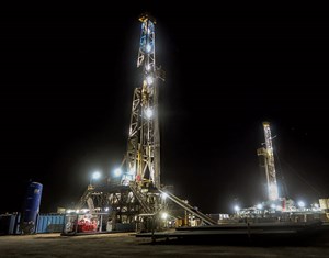 Fig. 1. Two rigs working on the Texas District 8 side of the Permian basin. Photo: Latshaw Drilling.