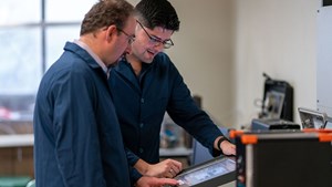 Gildin and graduate student Enrique Losoya review advisory system research. | Image: Texas A&amp;M Engineering&#x2F;Matthew Linguist