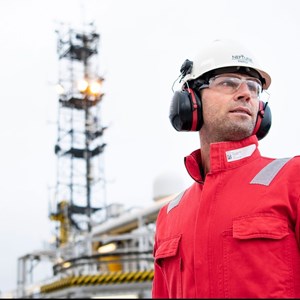oil and gas employee wearing a red jumpsuit
