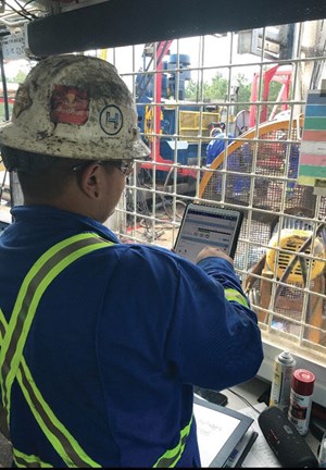 Fig. 1. A crew member using an iPad to run a Nabors’ app.