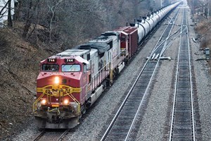 A majority of crude-by-rail traffic originating out of the Bakken shale in North Dakota is headed toward refineries in the eastern U.S. An example is this eastbound BNSF Railway oil train passing by the Highlands Metra station in Hinsdale, Ill. (west of Chicago), on Feb. 21, 2015. Photo by David Lassen.