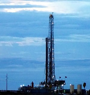 oil rig against blue sky in Texas