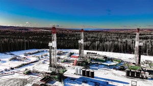 Fig. 1. Symbolizing the resurgence of Canadian drilling, three rigs work on a pad at Kakwa, Alberta, in November 2021. Image: Precision Drilling Corporation.